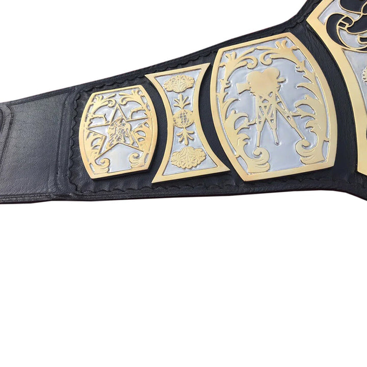 Close-up of UWF wrestling championship belt with detailed gold and silver plates on black leather